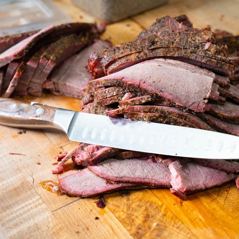 Hand-sliced brisket with smoke ring at Southern Luv BBQ Tampa