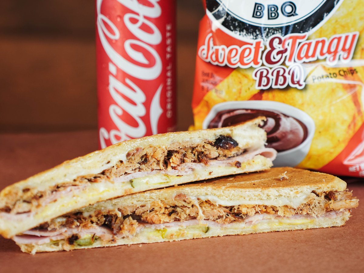 Award Winning Cuban — Pulled pork, smoked ham, Swiss, pickles, mustard on Cuban bread.